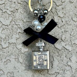 Luxe Silver Perfume Bottle Keychain/Bag Charm with Black Bow